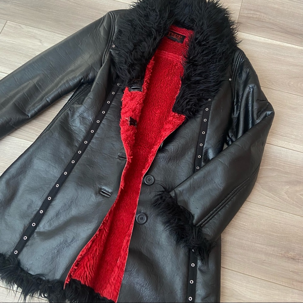 Tripp NYC  leather and faux fur bondage jacket
